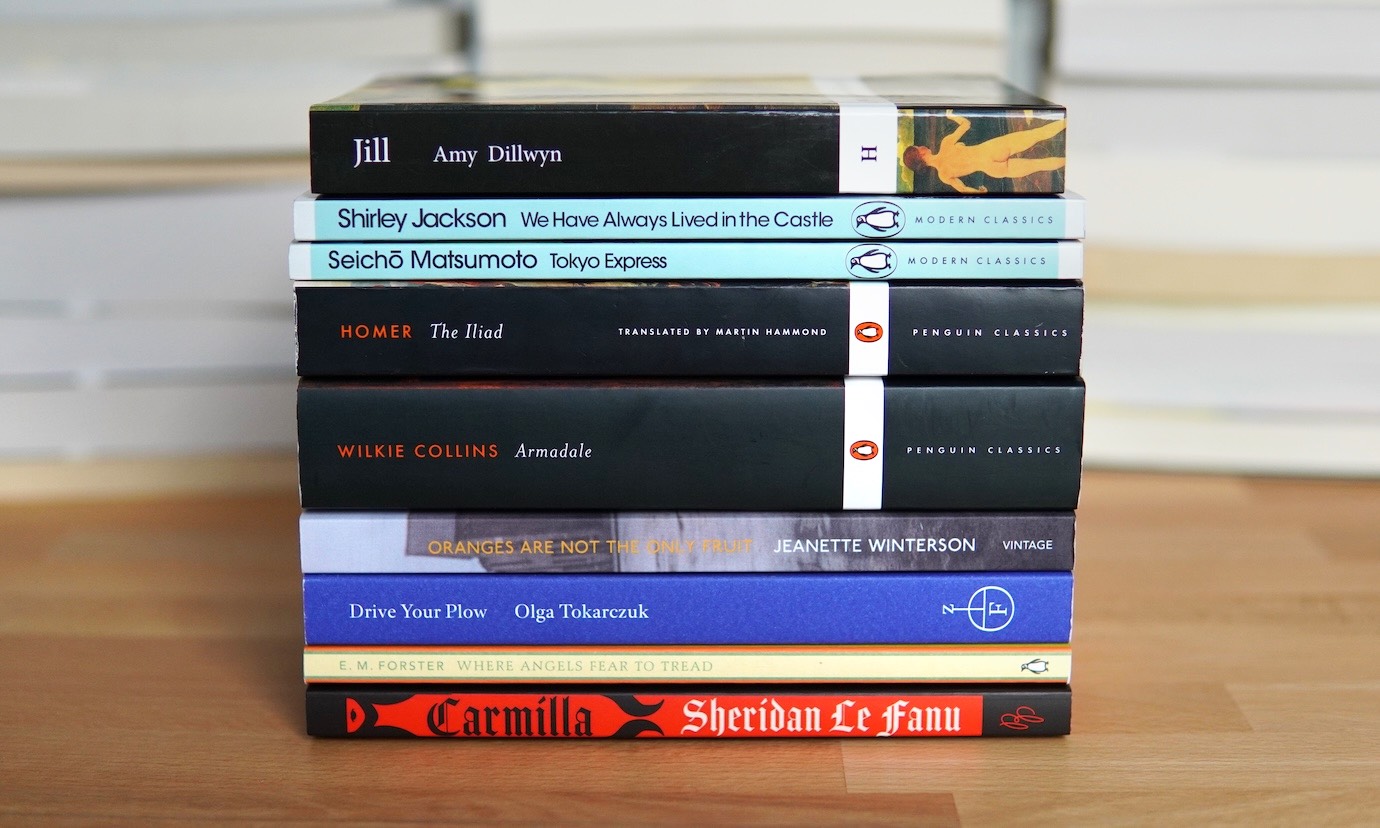 Photo of nine stacked book spines.