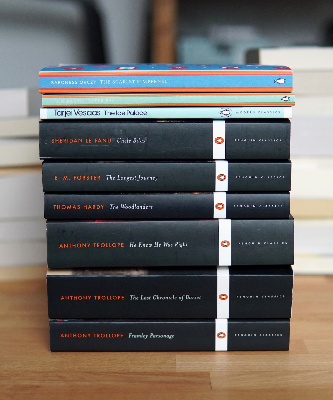 A stack of nine books published by Penguin.